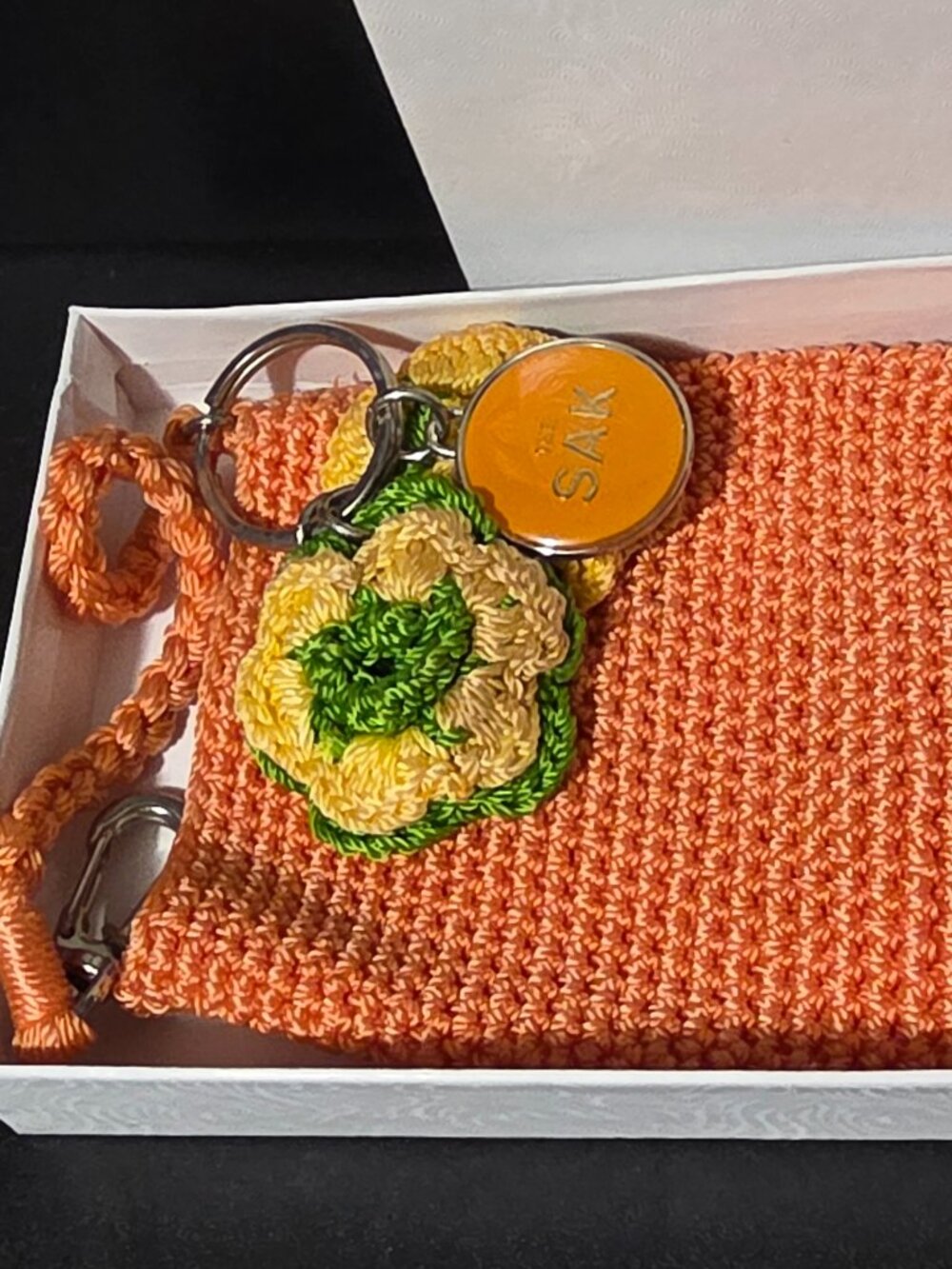 The Sak orange Crochet Mini Pouch